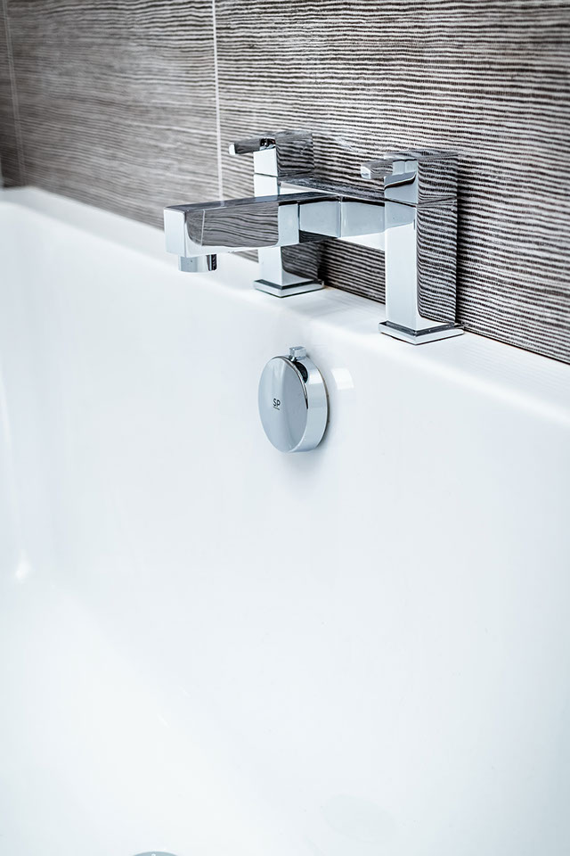 Contemporary bath with taps